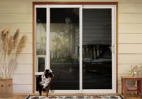 sliding glass door with built-in doggie door