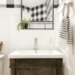 The bold buffalo plaid print of the wallpaper in thekanefive 's