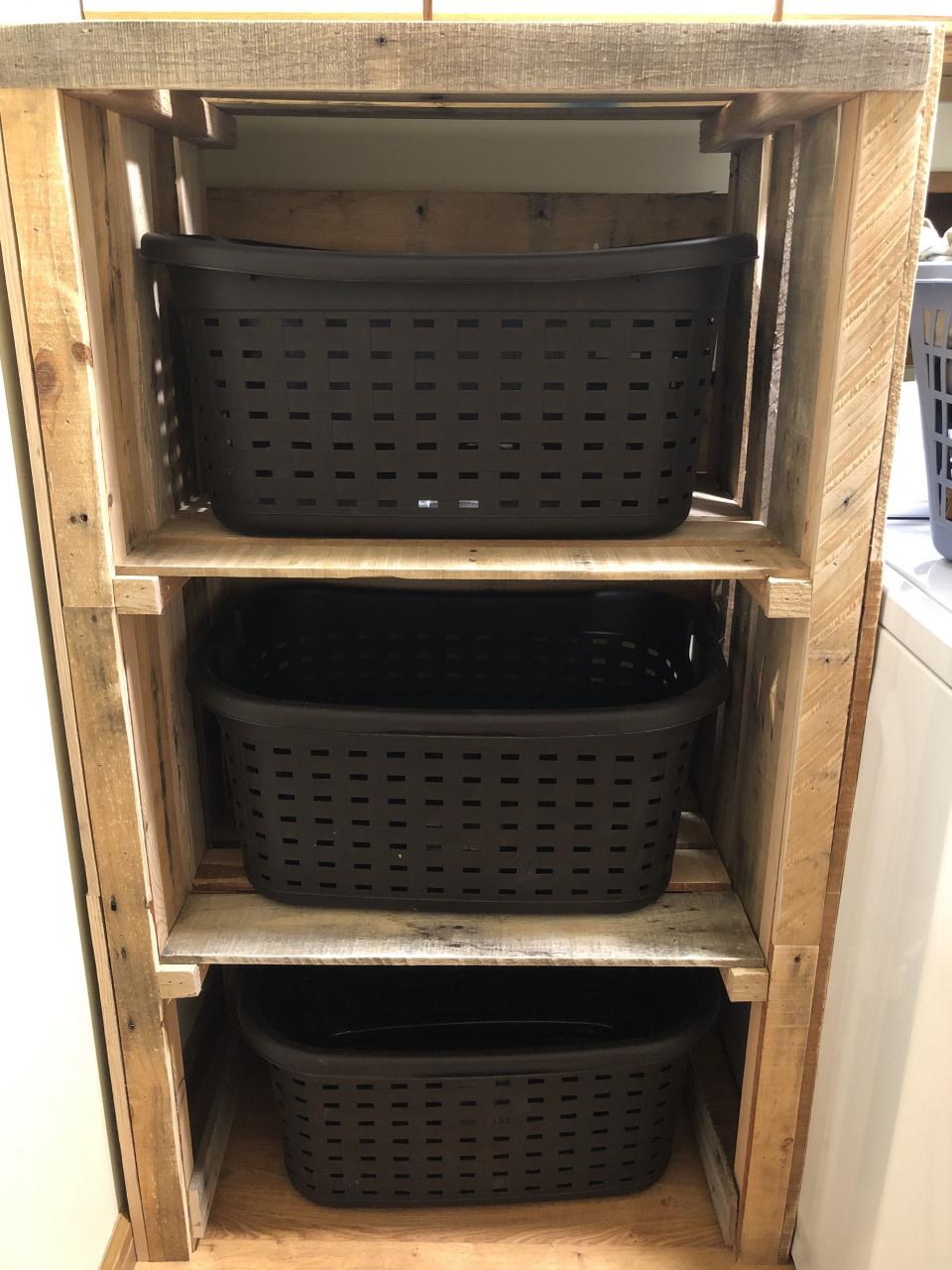 My husband made me a laundry basket storage unit. Love it!! Laundry
