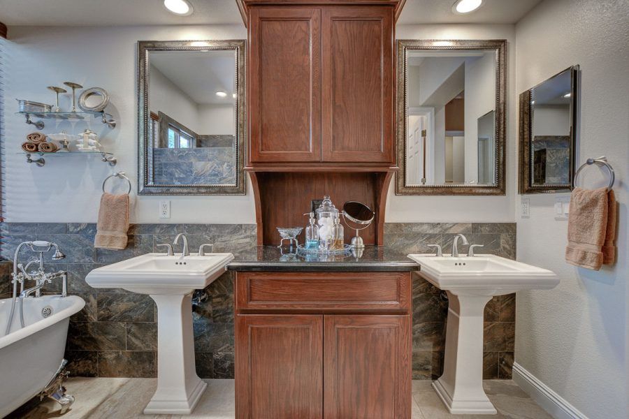 Pedestal sinks will make your bathroom look bigger! Anthem Country Club