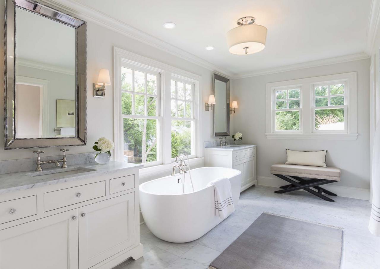 High end white master bathroom with large soaking tub Andrea Rugg