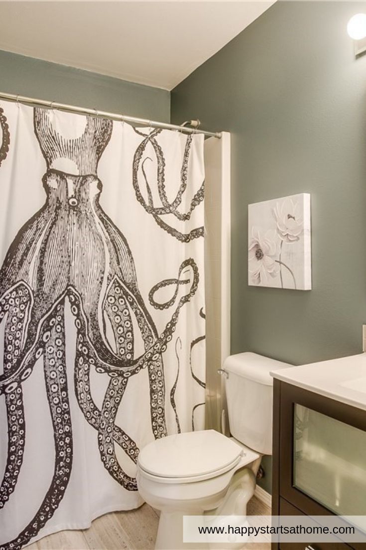 This bathroom is complete with a whimsical octopus shower curtain! Our