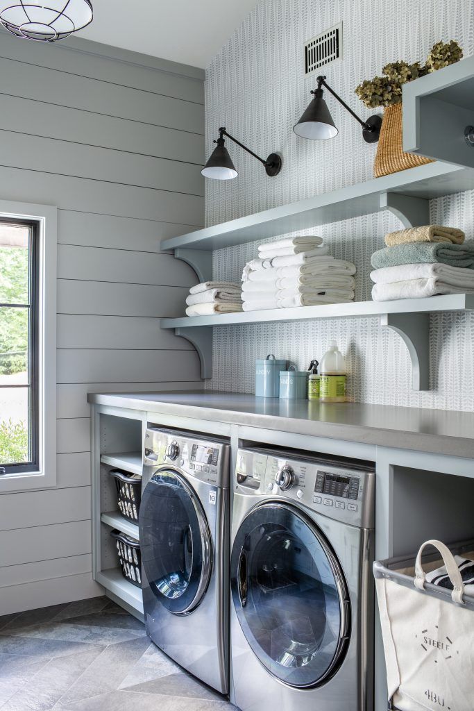 Countertop over the washer and dryer + open shelving in the laundry