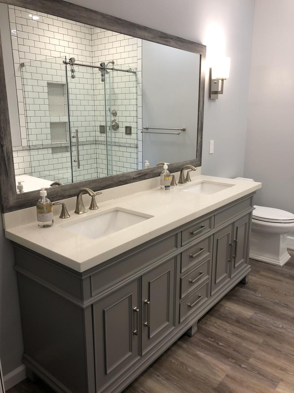 Grey costco vanity, grey and white bathroom, luxury vinyl plank floors