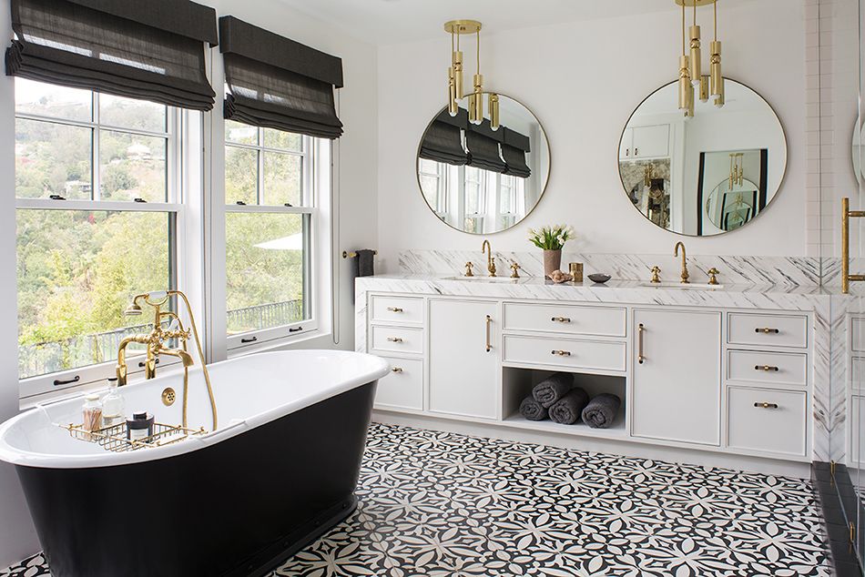 Glam black and white bathroom in a Hollywood Hills home Black Bathtub