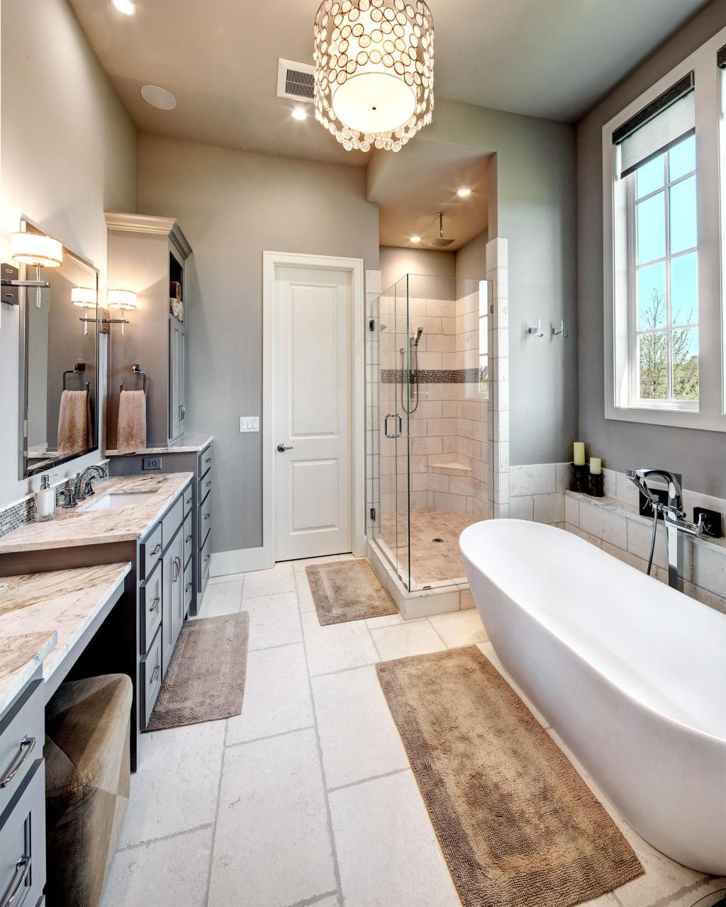 Large master bathroom with double vanities. Large tub under window