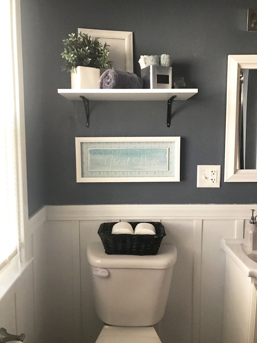 Check out this neutral gray bathroom with white board and batten. Love