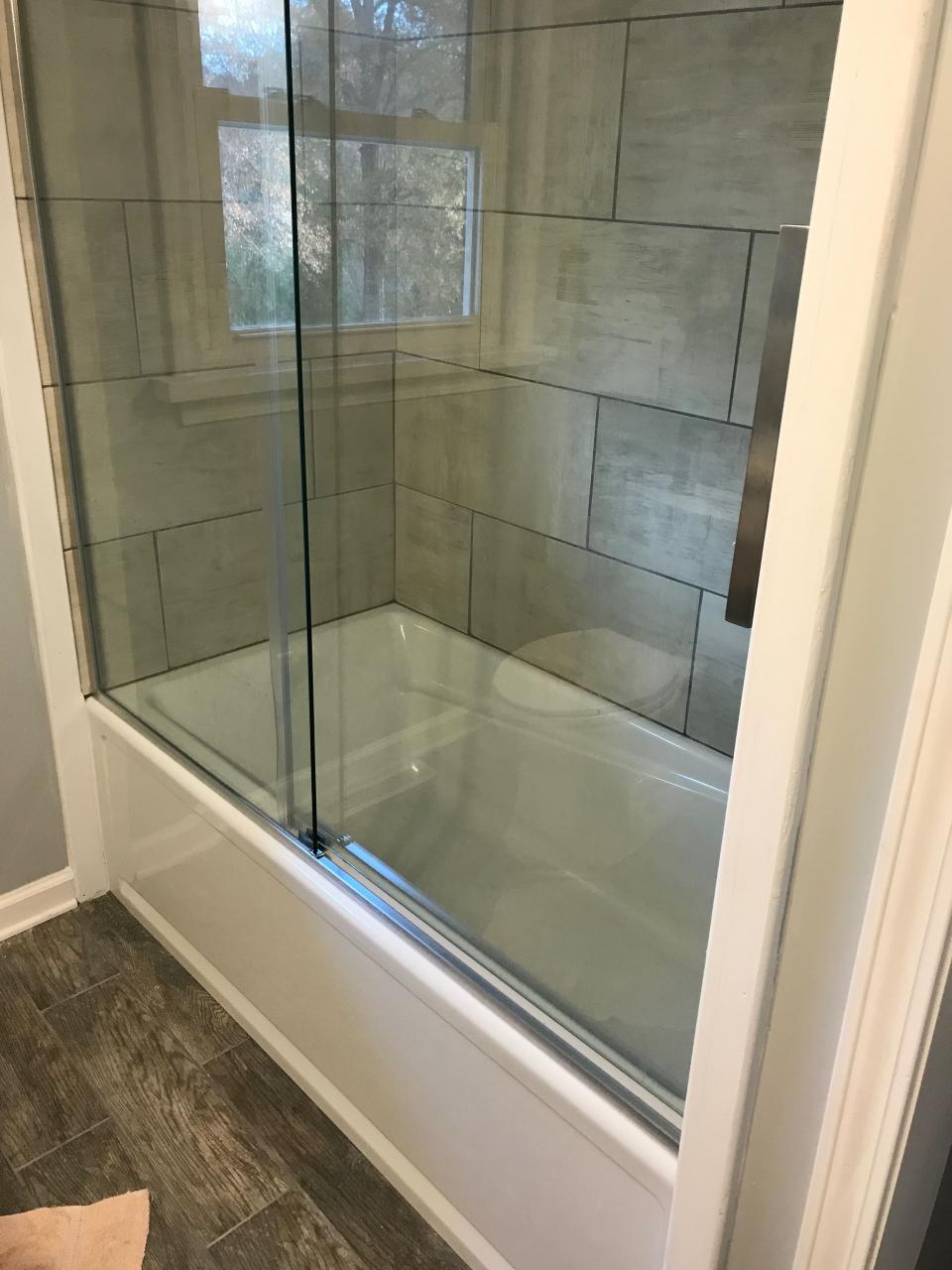 Deep soaker tub. Rolling shower doors. Large tiled shower. Bathrooms