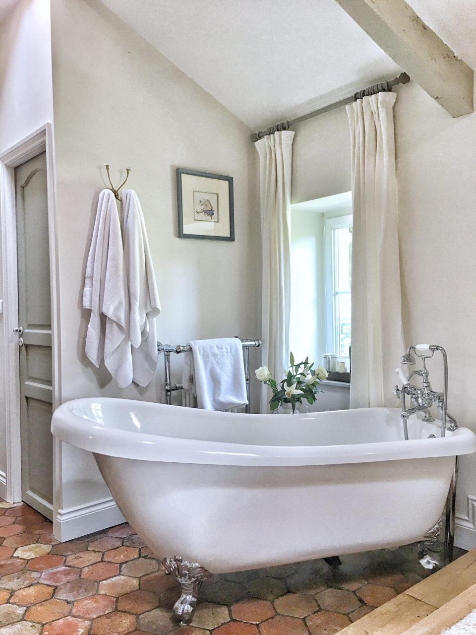 Quiet and timeless hues in a French farmhouse bathroom by Vivi et