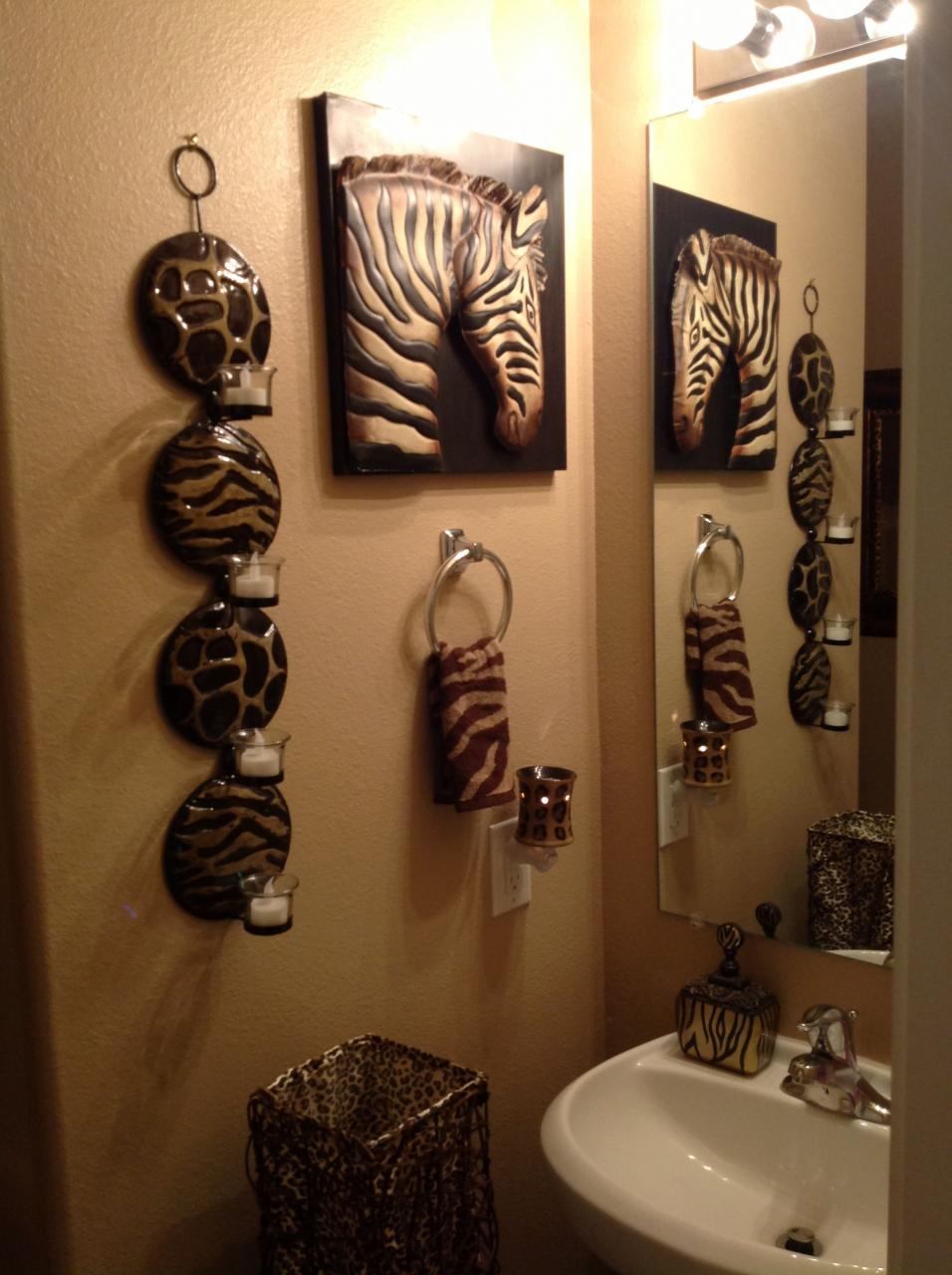 the bathroom is decorated with zebras and other animal themed items on