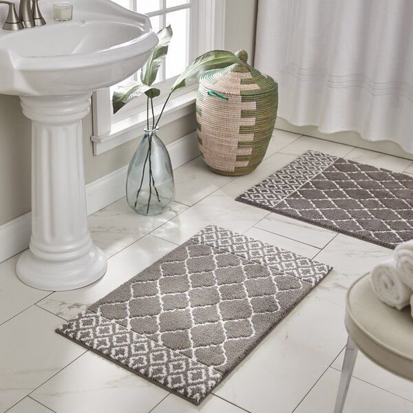 Bring warmth and color to your bathroom with these decorative bath rugs