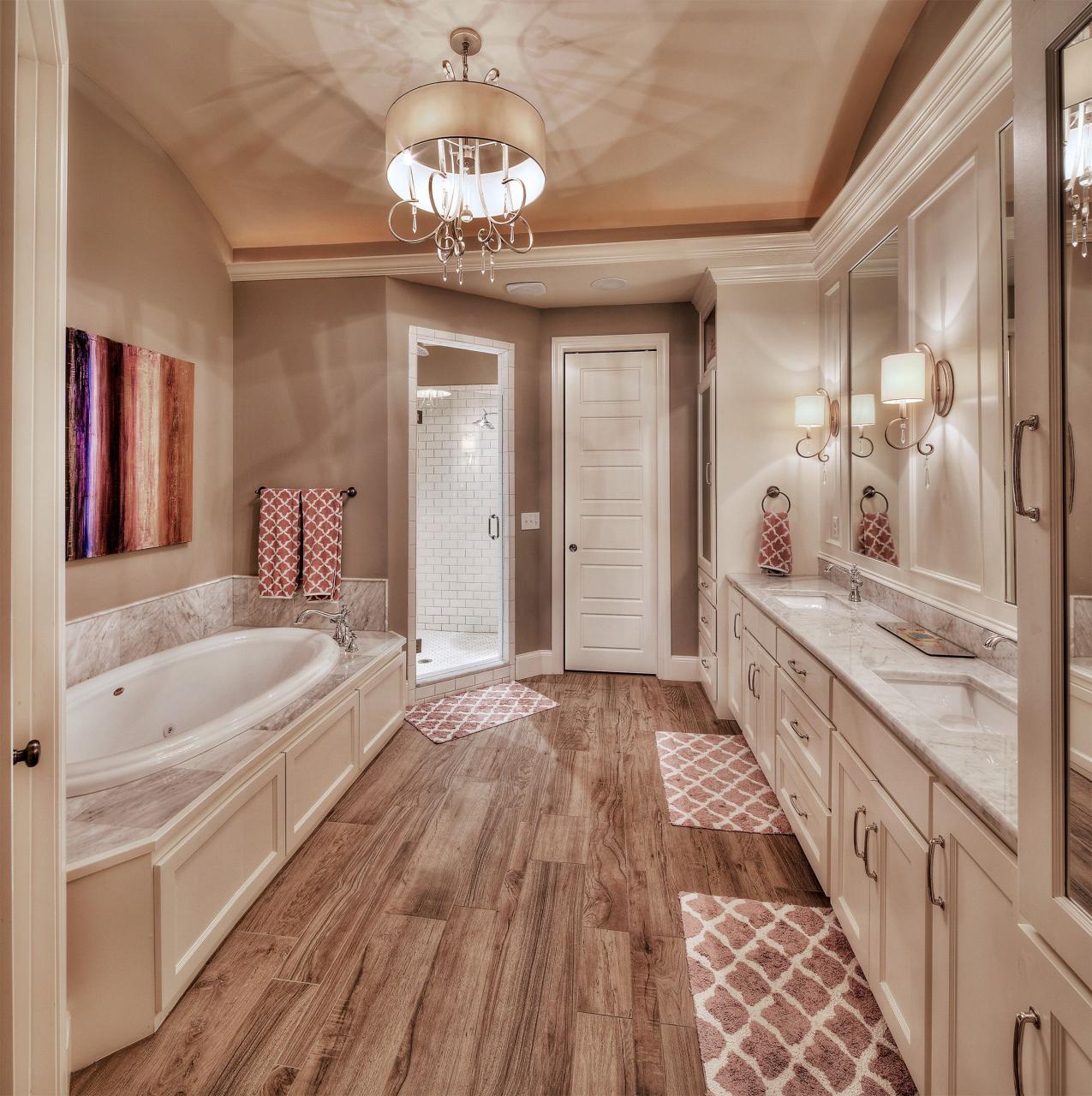 Master bathroom hardwood floors, large tub, his and her sink Dream