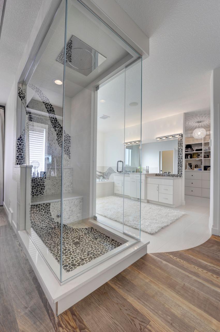 high glam shower is open to the master bedroom space, separating the
