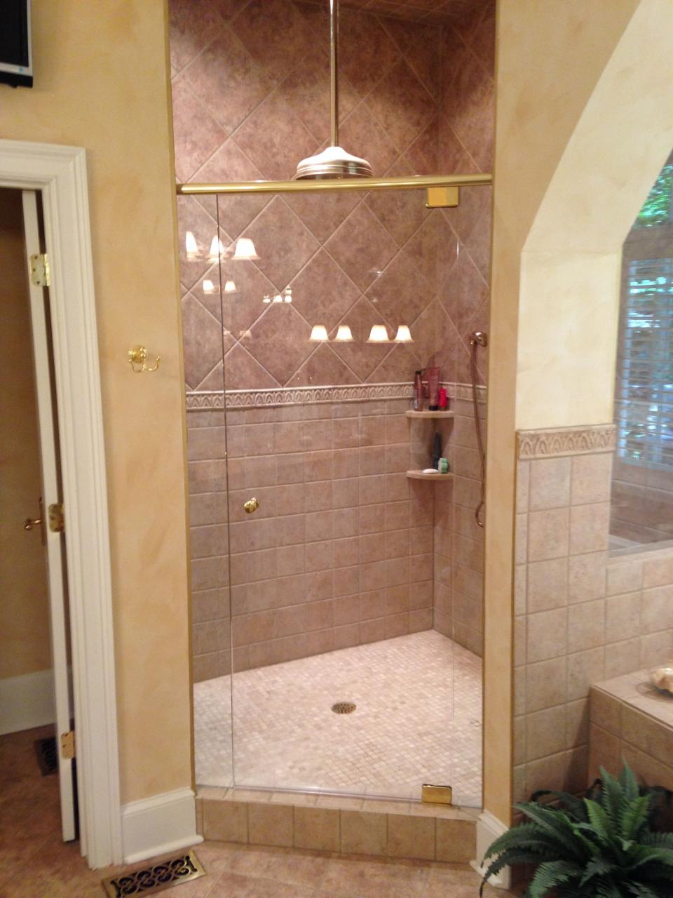 Frameless shower in master bathroom with header Athens,