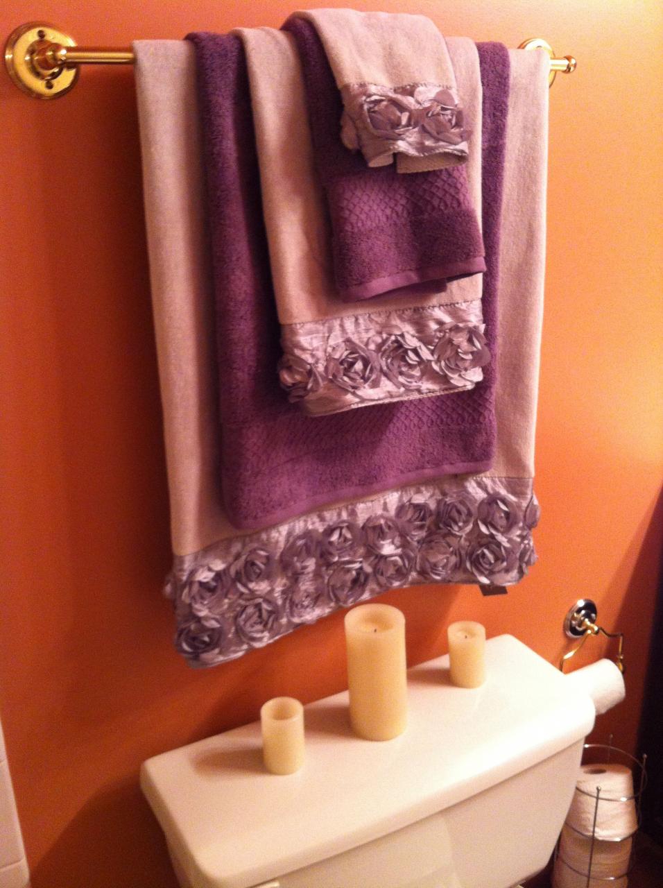 Bathroom update! Nice grey towels with decorative roses and deep purple