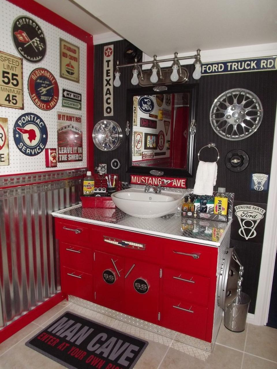 a red and black bathroom with lots of on the wall