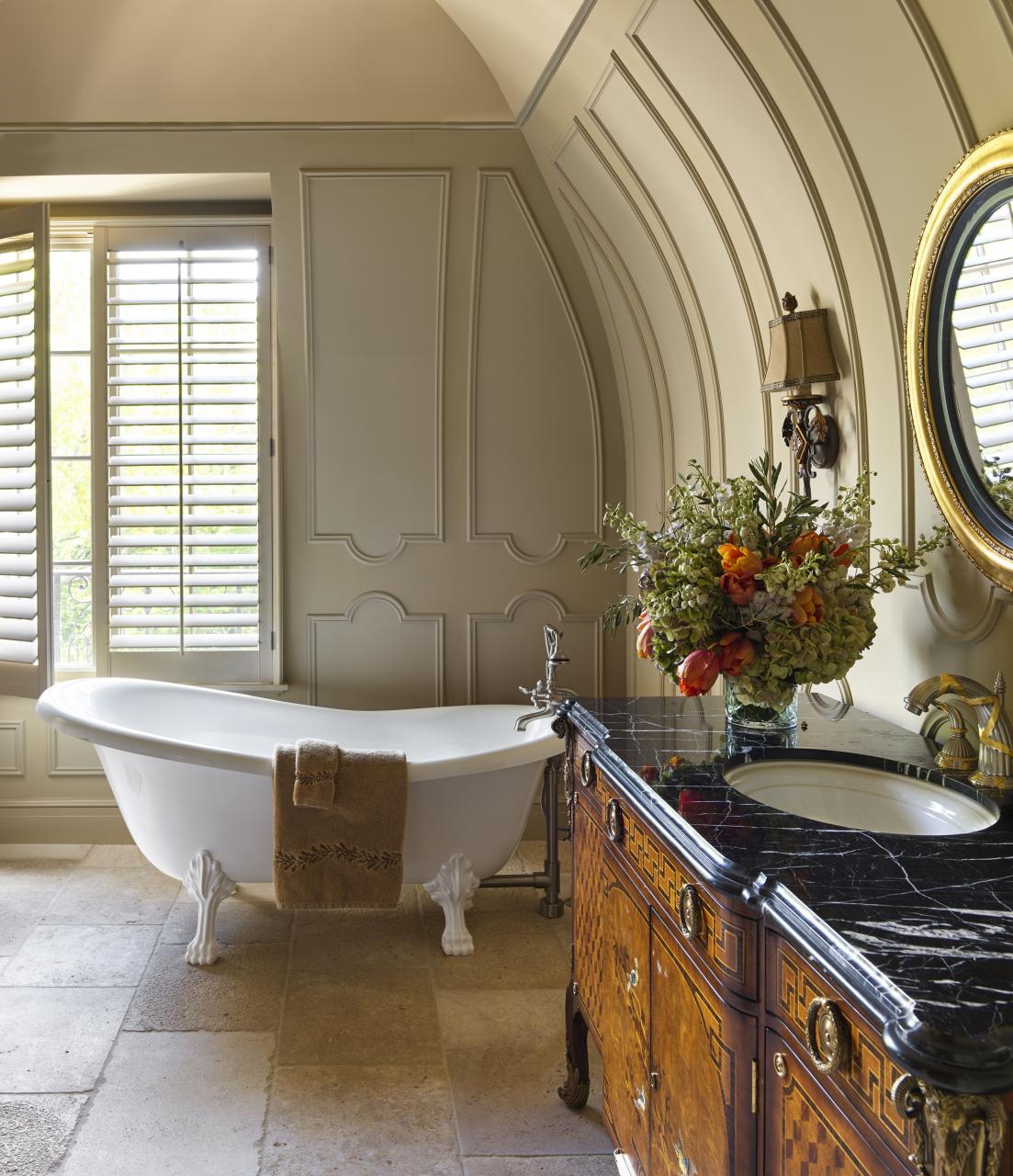 A guest bath with historic reclaimed vanities Victorian bathroom